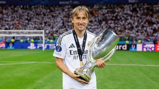 Real Madrid Legend Luka Modric Posing With the UEFA Super Cup