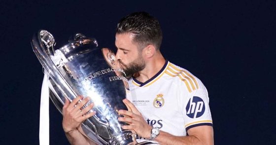 Real Madrid Legend Nacho Fernandez Kissing the Champions League Trophy