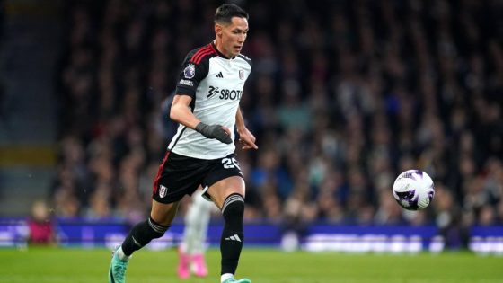 Sasa Lukic Dribbling the Ball While in Action for Premier League Side Fulham