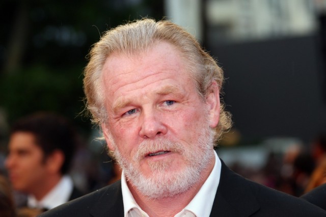 Nick Nolte talks on the red carpet.