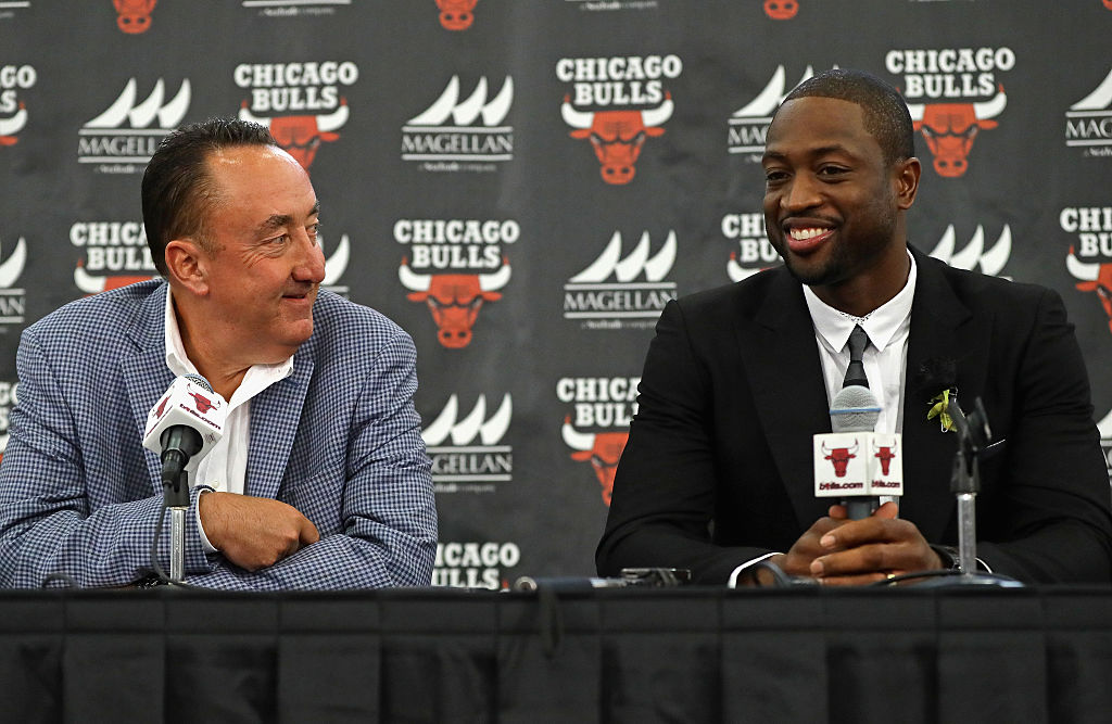 General Manager Gar Forman of the Chicago Bulls presents new Bull Dwyane Wade during an introductory press conference.