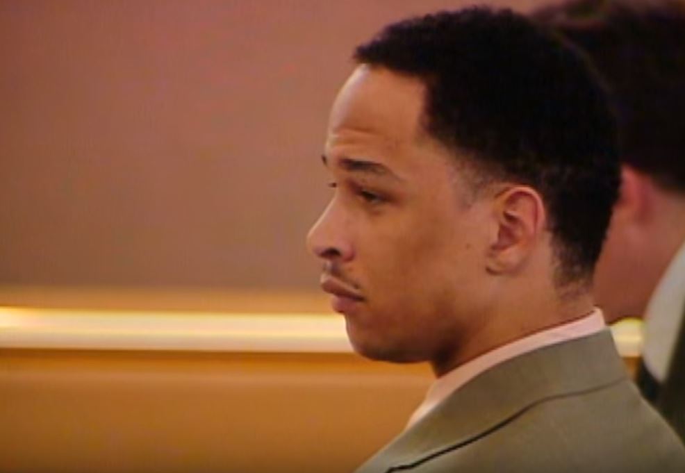 Rae Carruth sits with his lawyers during the trial.