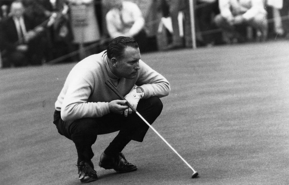 Golfer Billy Casper, who won the 1966 US Open, lining up a put