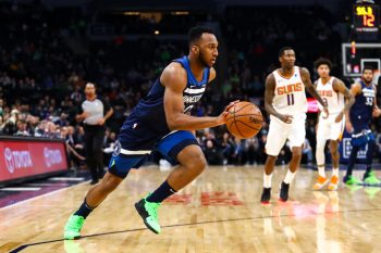 NBA guard Josh Okogie dribbles the ball.