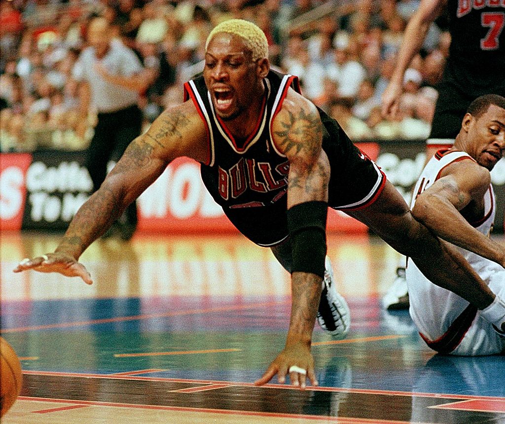 Dennis Rodman of the Chicago Bulls grabs a rebound in Game One of