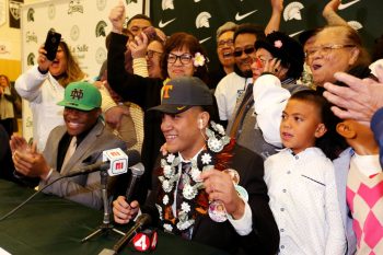 High school football players commit to their college football programs of choice during National Signing Day in 2019