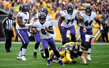 Led by quarterback Lamar Jackson, the Baltimore Ravens are on pace to break NFL rushing records.
