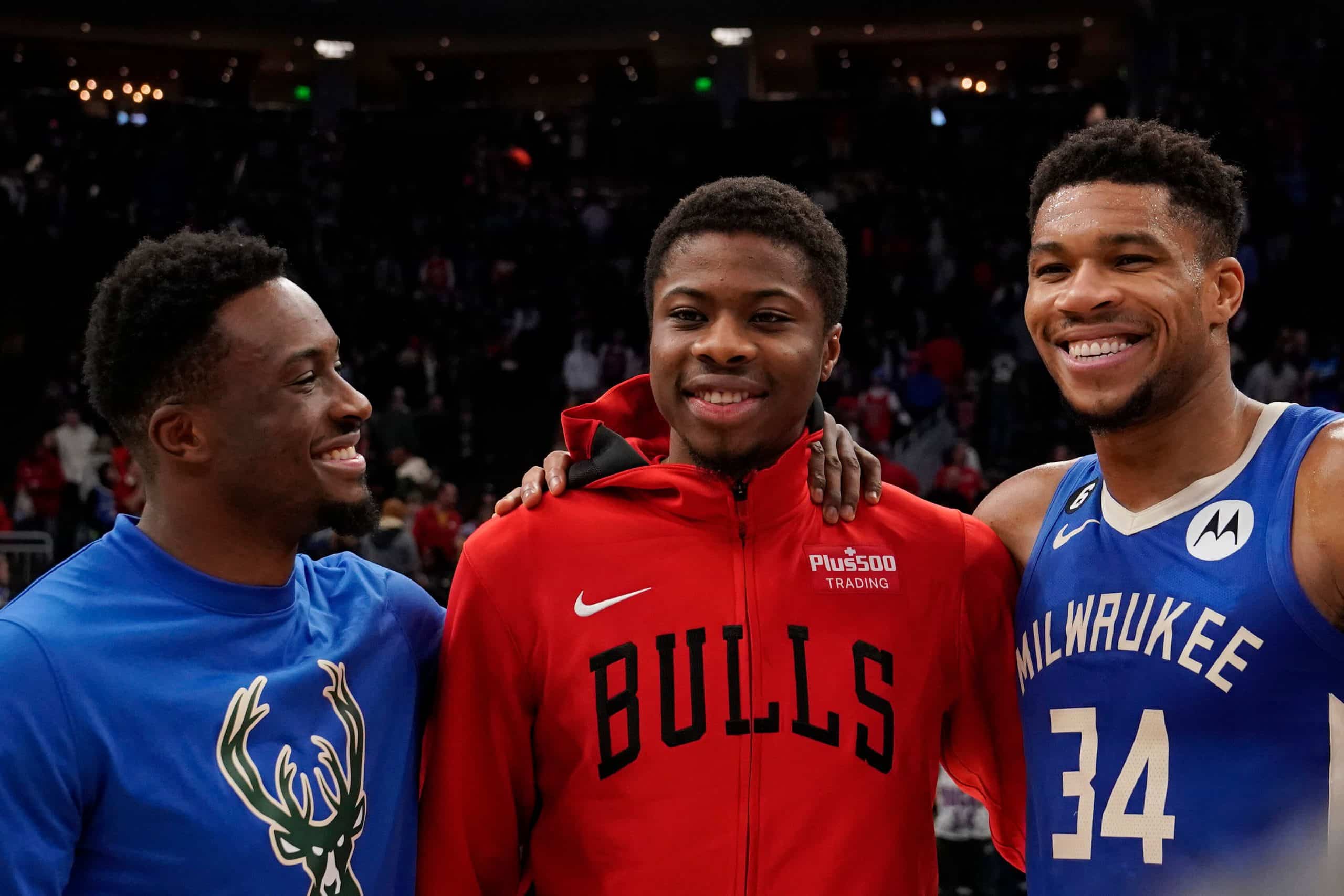 Kostas Antetokounmpo of the Chicago Bulls takes a photo with his brothers Thanasis Antetokounmpo and Giannis Antetokounmpo of the Milwaukee Bucks.