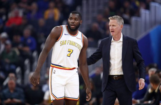 NBA rookie, Eric Paschall, talks with coach Steve Kerr