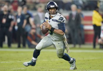 NFL quarterbacks, like Russell Wilson, command massive salaries.