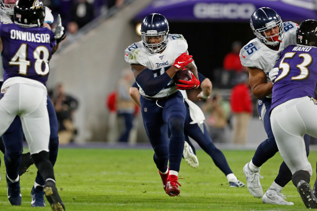 Eddie George of the Tennessee Titans carries the ball against the