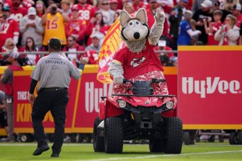 Mascot K.C. Wolf drives onto the field ahead of a Kansas City Chiefs game.