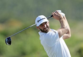 Dustin Johnson hits a drive.