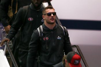 Defensive end Nick Bosa walks off the 49ers' plane