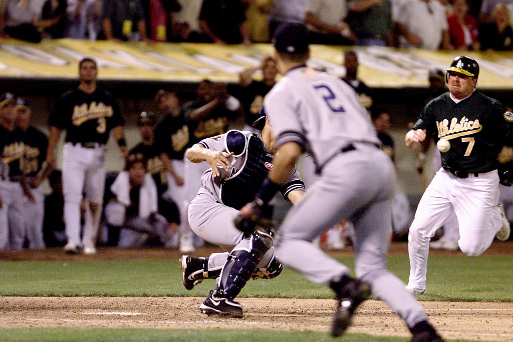 ATHLETIC1-C-14OCT01-SP-MAC A's Jeremy Giambi hits a pop fly for an