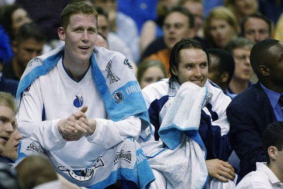 Shawn Bradley and Steve Nash watch the game