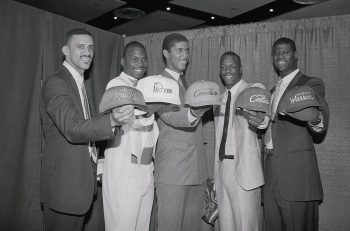 First Five Picks of College Player Draft Displaying Hats