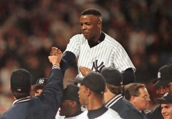 New York Yankees' pitcher Dwight Gooden is carried