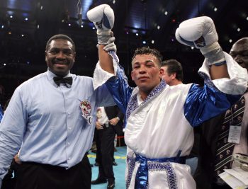 Arturo Gatti holds up his fists after winning a bout