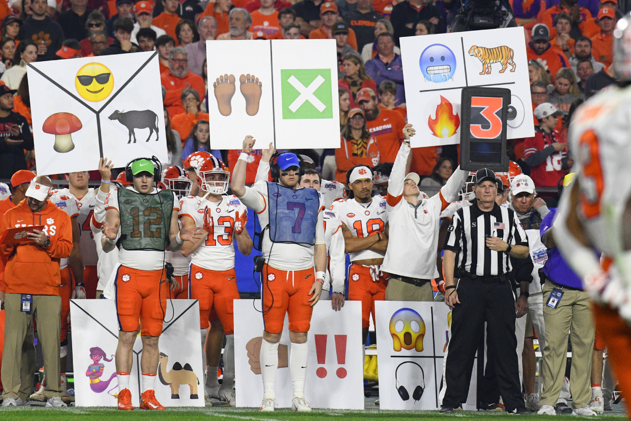 Why Do College Football Teams Hold Up Signs For The Offense 