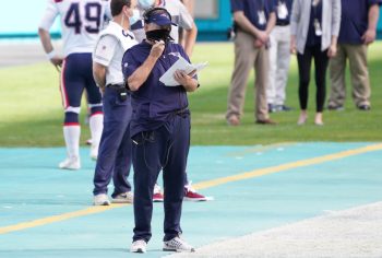 Bill Belichick of the New England Patriots coaches against the Miami Dolphins at Hard Rock Stadium on December 20, 2020.