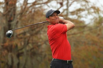 Tiger Woods hits a drive during the PNC Championship