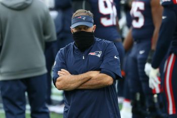 New England Patriots head coach Bill Belichick stands on the sidelines during a 2020 NFL game.