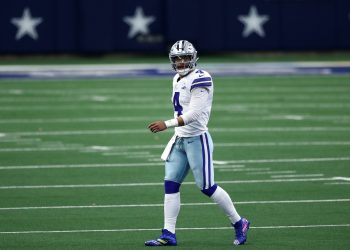 Dallas Cowboy quarterback Dak Prescott walks off the field.