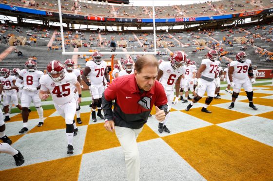 Alabama head coach Nick Saban jogs onto the field as the Crimson Tide prepare to play Tennessee.