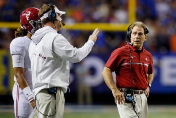 Alabama head coach Nick Saban watches offensive coordinator Lane Kiffin talk to Jalen Hurts during the Crimson Tide's SEC championship game against the Florida Gators.