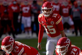 Patrick Mahomes of the Kansas City Chiefs prepares to take a snap in a 2021 playoff game against the Cleveland Browns.