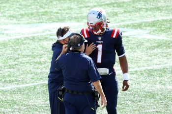 New England Patriots QB Cam Newton talks with offensive coordinator Josh McDaniels and head coach Bill Belichick.