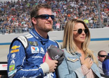 Dale Earnhardt Jr. and wife Amy hold hands over hearts before race