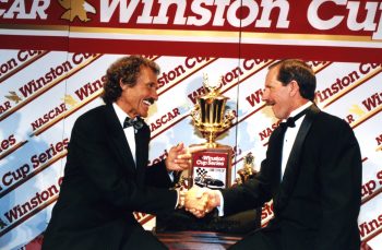 Richard Petty and Dale Earnhardt exchange congratulations after the 1994 NASCAR campaign.