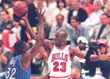 Michael Jordan and Shaquille O'Neal meet in NBA action in 1995.