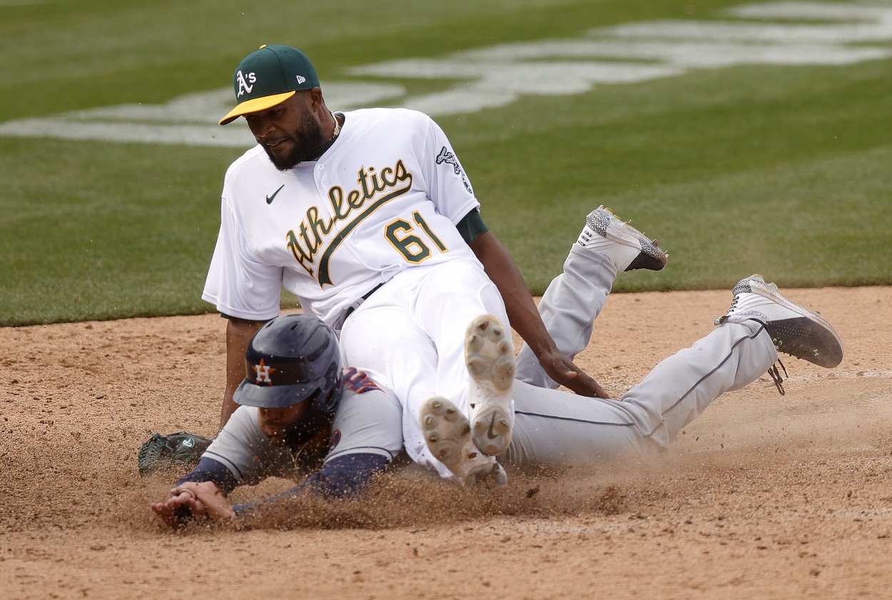 Oakland A's clobber Houston Astros, now share first place