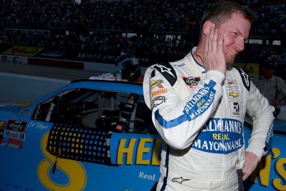 Dale Earnhardt Jr. stands next to his car after a 2019 NASCAR Xfinity Series race.