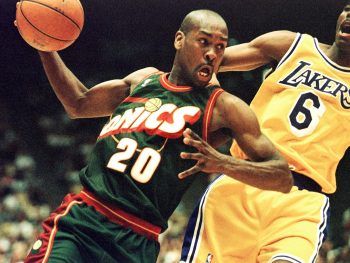 Gary Payton dribbles the ball as a member of the Seattle SuperSonics.