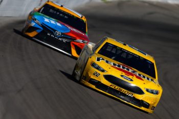 Joey Logano leads Kyle Busch