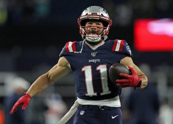 Julian Edelman carries the ball during warmups.