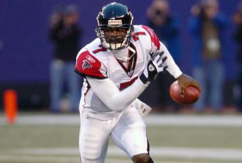 Michael Vick of the Atlanta Falcons runs with the ball against the New York Giants during an NFL game on Nov. 21, 2004. at MetLife Stadium in East Rutherford, New Jersey.