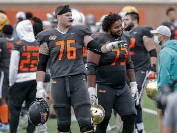 New Buffalo Bills Offensive Linemen Spencer Brown from Northern Iowa and Aaron Banks from Notre Dame of the National Team on the sidelines during the 2021 Resse's Senior Bowl at Hancock Whitney Stadium on the campus of the University of South Alabama on January 30, 2021 in Mobile, Alabama.