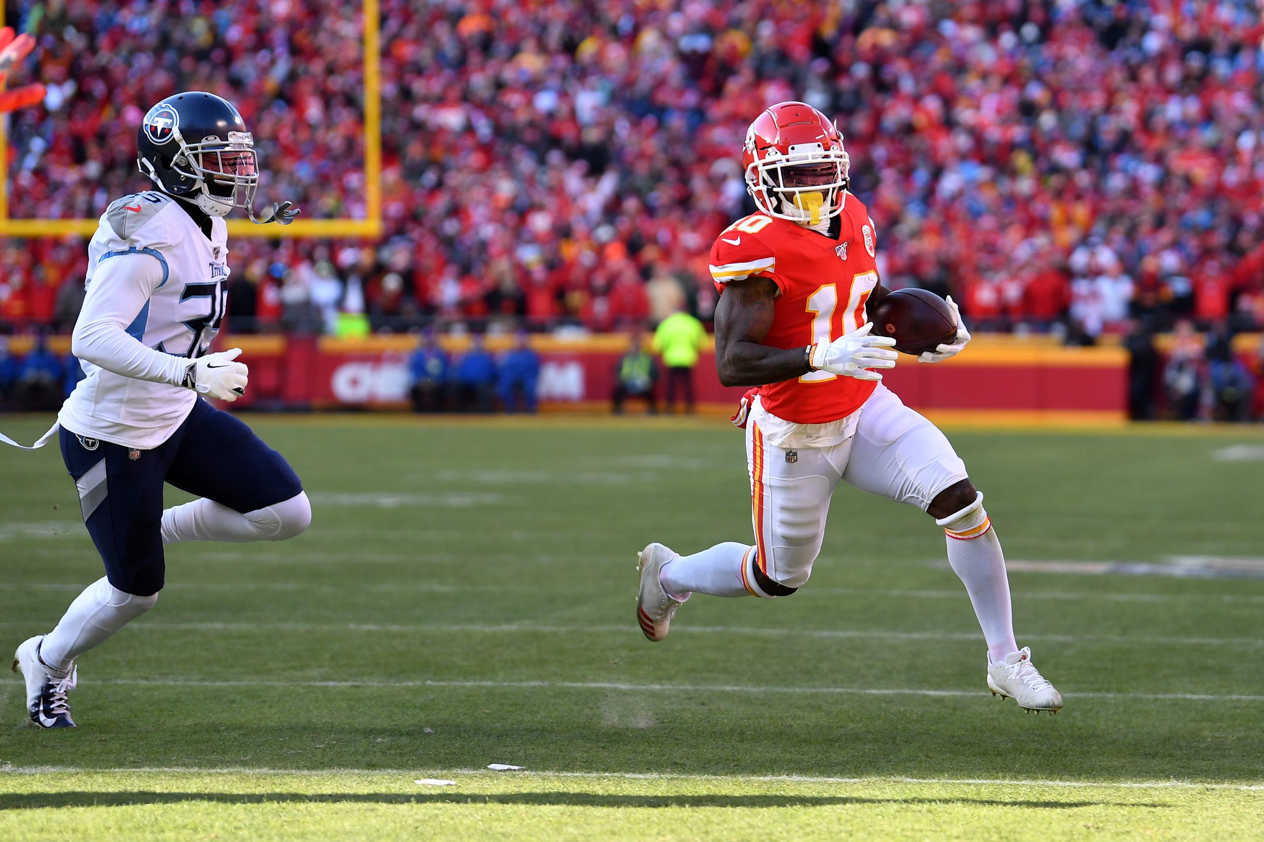 Tyreek Hill of the Kansas City Chiefs runs for a 7 yard touchdown in the first quarter against the Tennessee Titans in the AFC Championship Game at Arrowhead Stadium on January 19, 2020 in Kansas City, Missouri.