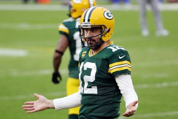 Green Bay Packers quarterback Aaron Rodgers gestures on the field