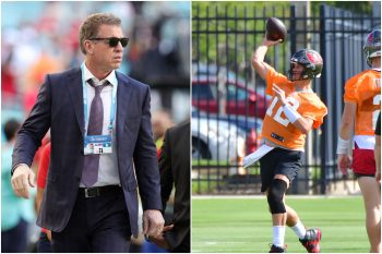 Pro Football Hall of Famer Troy Aikman walks across the field as Tom Brady throws a pass during Buccaneers practice.