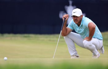 Brooks Koepka lines up a putt during the 2021 U.S. Open