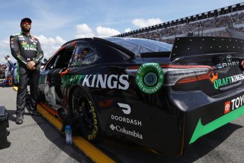 Bubba Wallace poses with his car before Sunday's race.