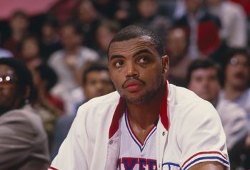 Philadelphia 76ers forward Charles Barkley looks on from the bench.