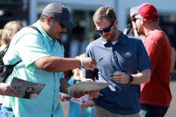 Dale Earnhardt Jr. signs autograph for a fan