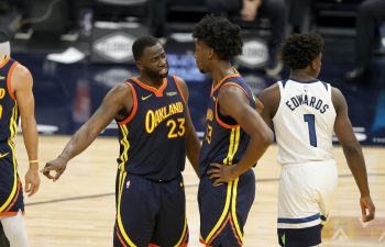 Draymond Green talks to James Wiseman of the Golden State Warriors during their game against the Minnesota Timberwolves at Chase Center on January 25, 2021 in San Francisco, California.